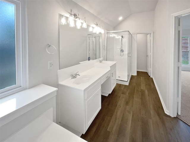 4162 Stone Hollow Way, Fort Worth, TX 76040 - full bathroom featuring a shower stall, wood finished floors, double vanity, vaulted ceiling, and baseboards
