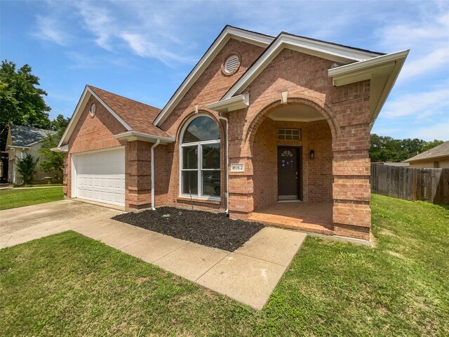 4162 Stone Hollow Way, Fort Worth, TX 76040 - view of front of property featuring brick siding, an attached garage, driveway, and a porch