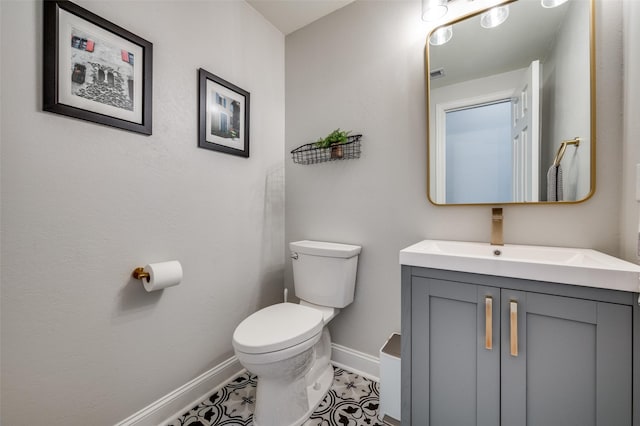 2750 Bandolier Ln, Frisco, TX 75033 - bathroom with baseboards, toilet, and vanity