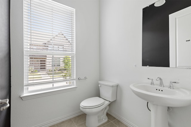 8509 Barnbougle Dunes Dr, Mckinney, TX 75070 - half bathroom featuring toilet, tile patterned flooring, and baseboards