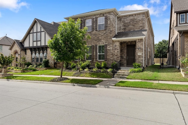 8509 Barnbougle Dunes Dr, Mckinney, TX 75070 - view of front facade with brick siding and a front yard