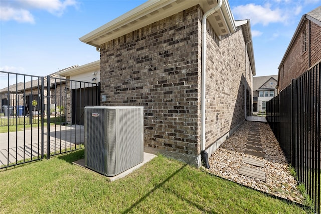 8509 Barnbougle Dunes Dr, Mckinney, TX 75070 - view of home's exterior featuring central AC and brick siding