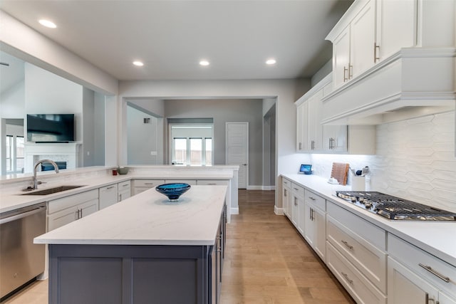 518 Syracuse St, Haslet, TX 76052 - kitchen with stainless steel appliances, a sink, recessed lighting, a center island, and white cabinetry