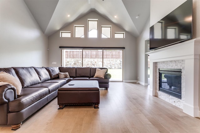 518 Syracuse St, Haslet, TX 76052 - living room with light wood-type flooring, a fireplace, and high vaulted ceiling
