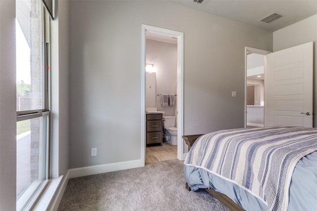 518 Syracuse St, Haslet, TX 76052 - bedroom featuring light carpet, baseboards, and connected bathroom