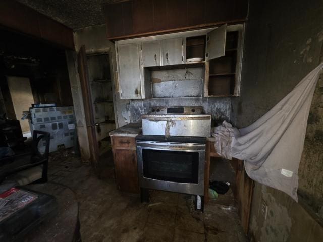 1001 S 27th St, Copperas Cove, TX 76522 - kitchen with stainless steel range with electric cooktop and open shelves