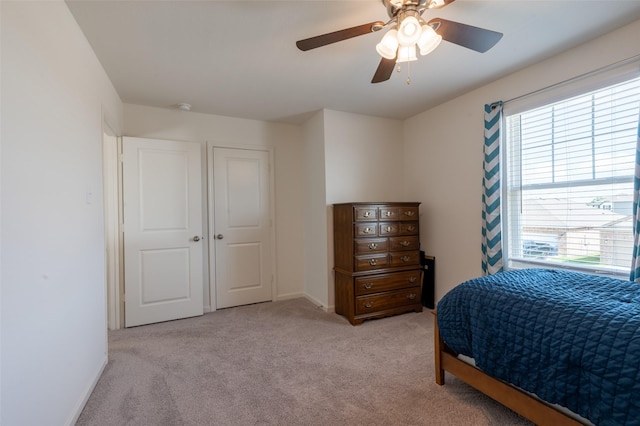 1401 Ancer Way, Fort Worth, TX 76052 - bedroom featuring multiple windows, light carpet, a ceiling fan, and baseboards