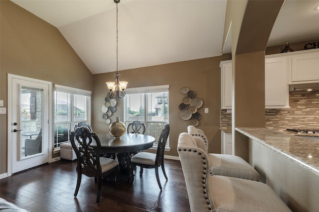 4426 Mineral Creek Trl, Celina, TX 75078 - dining room with a chandelier, high vaulted ceiling, dark wood finished floors, and baseboards