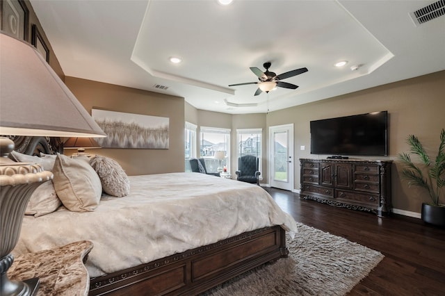 4426 Mineral Creek Trl, Celina, TX 75078 - bedroom with a raised ceiling, recessed lighting, dark wood-style floors, baseboards, and ceiling fan