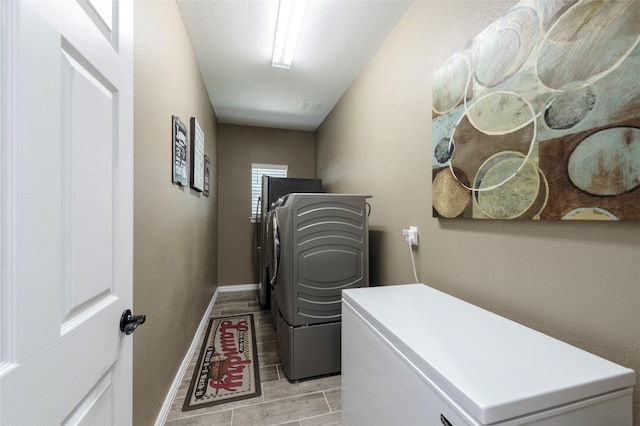 4426 Mineral Creek Trl, Celina, TX 75078 - laundry room featuring independent washer and dryer, baseboards, and a desk