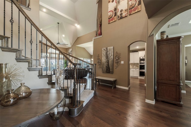 4426 Mineral Creek Trl, Celina, TX 75078 - stairway featuring arched walkways, wood finished floors, high vaulted ceiling, a ceiling fan, and baseboards