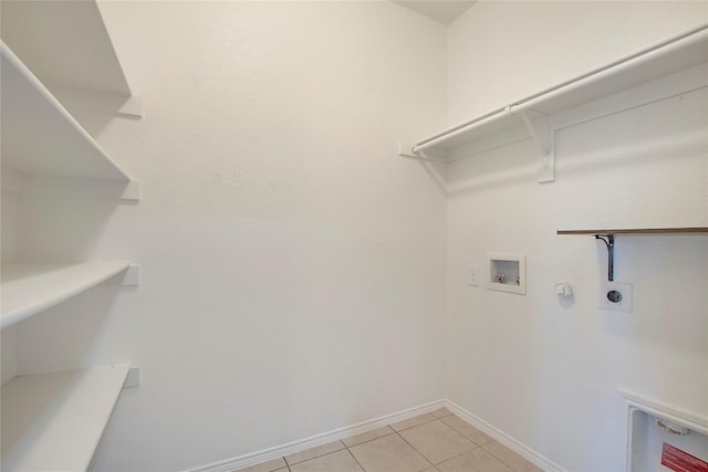 2154 Slow Stream Dr, Royse City, TX 75189 - laundry area with hookup for a washing machine, hookup for an electric dryer, light tile patterned floors, baseboards, and gas dryer hookup