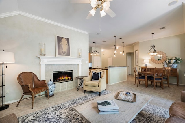 5312 Timber Park Dr, Flower Mound, TX 75028 - living room featuring light tile patterned floors, ceiling fan, a tile fireplace, baseboards, and ornamental molding
