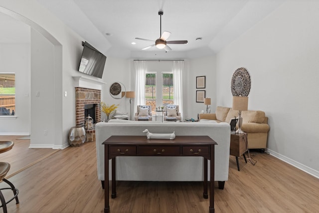 8228 Shady Valley Dr, Benbrook, TX 76116 - living area featuring a ceiling fan, arched walkways, plenty of natural light, light wood-style flooring, and recessed lighting