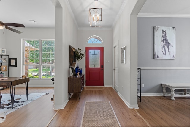 8228 Shady Valley Dr, Benbrook, TX 76116 - foyer with wood finished floors, crown molding, ceiling fan, and baseboards