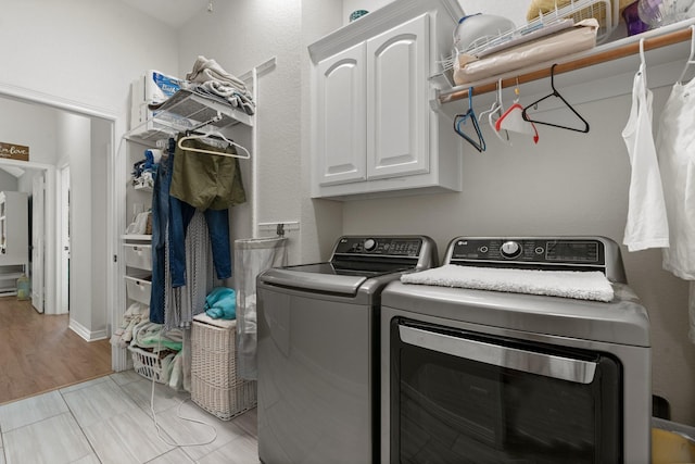 8228 Shady Valley Dr, Benbrook, TX 76116 - laundry room featuring cabinet space and washing machine and dryer