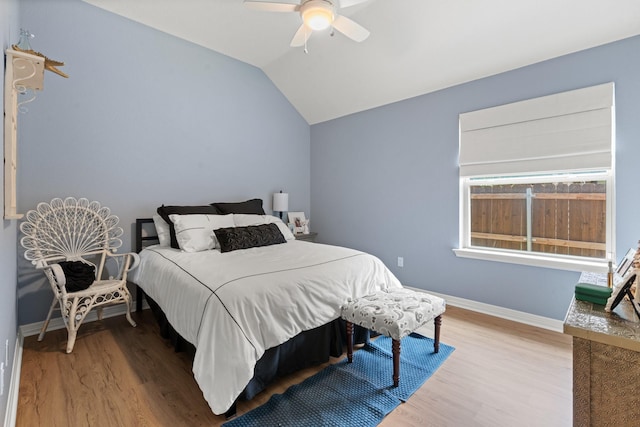 8228 Shady Valley Dr, Benbrook, TX 76116 - bedroom with wood finished floors, baseboards, vaulted ceiling, and a ceiling fan