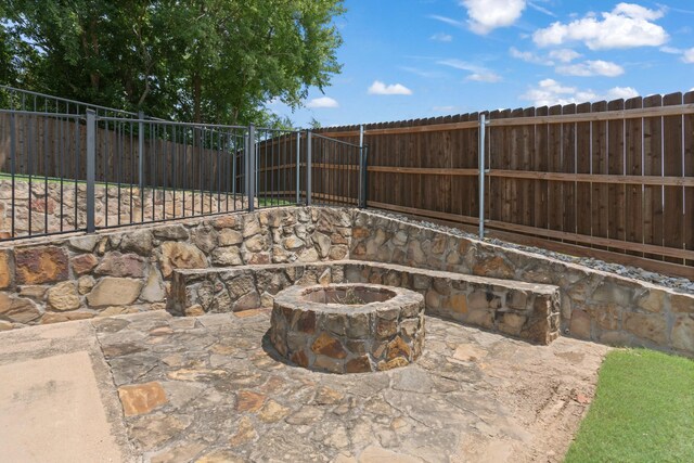 8228 Shady Valley Dr, Benbrook, TX 76116 - fenced backyard with a fire pit and a patio