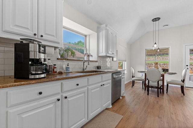 8228 Shady Valley Dr, Benbrook, TX 76116 - kitchen with dishwasher, a sink, vaulted ceiling, white cabinets, and plenty of natural light