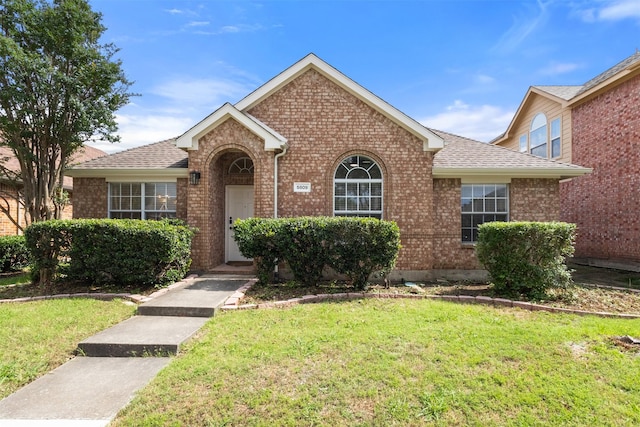 5809 Hidden Pine Ln, Mckinney, TX 75070 - view of front of home with brick siding and a front yard