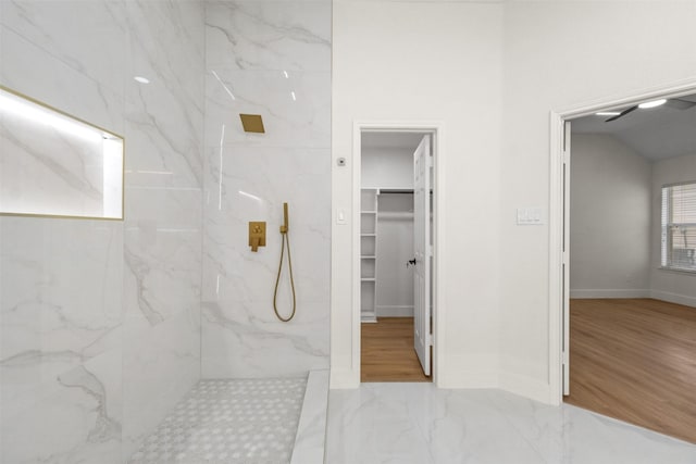 5809 Hidden Pine Ln, Mckinney, TX 75070 - bathroom with a marble finish shower, a walk in closet, marble finish flooring, and baseboards