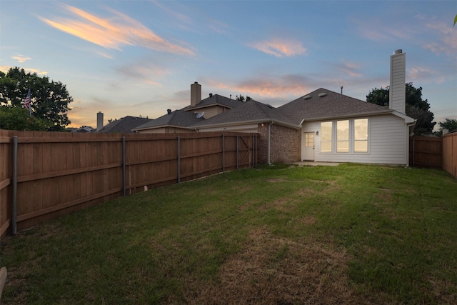 5809 Hidden Pine Ln, Mckinney, TX 75070 - back of property at dusk featuring a chimney