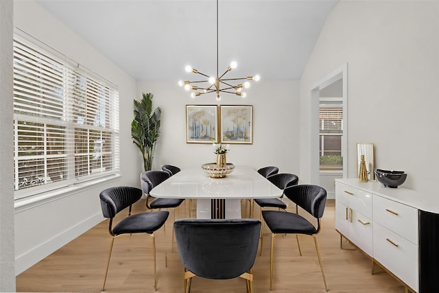 5809 Hidden Pine Ln, Mckinney, TX 75070 - dining area featuring a chandelier, vaulted ceiling, light wood-style floors, and baseboards