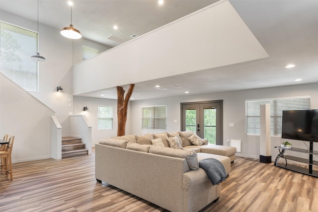 1327 Whispering Springs Dr, Tool, TX 75143 - living room featuring light wood finished floors, stairs, plenty of natural light, and recessed lighting