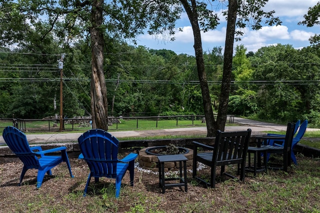 1327 Whispering Springs Dr, Tool, TX 75143 - view of yard with an outdoor fire pit and a wooded view