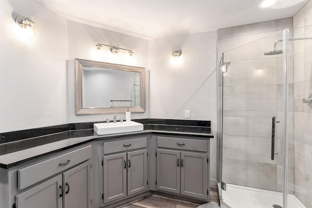 1327 Whispering Springs Dr, Tool, TX 75143 - bathroom with vanity, a shower stall, and wood finished floors
