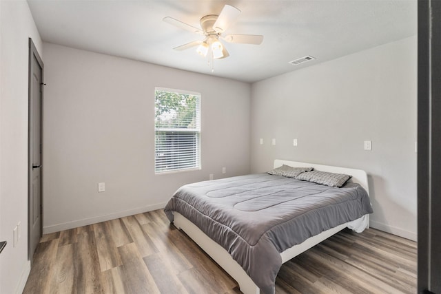 1327 Whispering Springs Dr, Tool, TX 75143 - bedroom with wood finished floors, baseboards, and ceiling fan