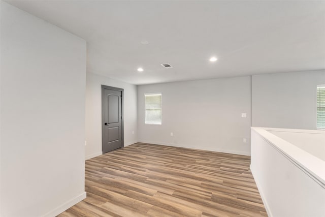 1327 Whispering Springs Dr, Tool, TX 75143 - unfurnished room featuring recessed lighting, healthy amount of natural light, light wood-style floors, and baseboards