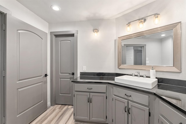 1327 Whispering Springs Dr, Tool, TX 75143 - bathroom with wood finished floors, vanity, and recessed lighting