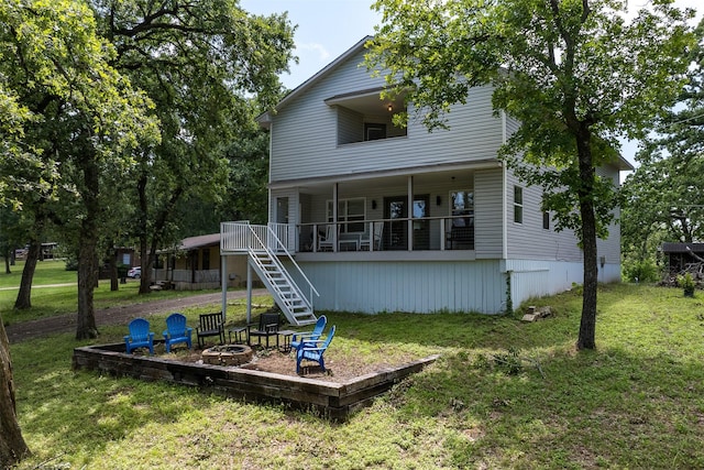 1327 Whispering Springs Dr, Tool, TX 75143 - back of property featuring a fire pit, stairway, and a yard