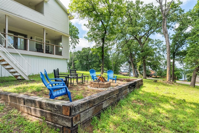1327 Whispering Springs Dr, Tool, TX 75143 - view of grassy yard with an outdoor fire pit and stairway