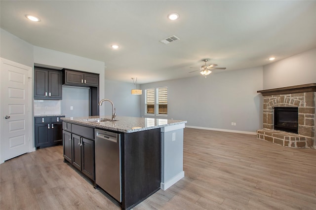 2151 Slow Stream Dr, Royse City, TX 75189 - kitchen featuring stainless steel dishwasher, a ceiling fan, open floor plan, light wood-type flooring, and recessed lighting