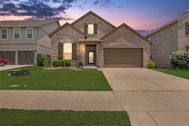 2151 Slow Stream Dr, Royse City, TX 75189 - french country inspired facade with brick siding, a yard, driveway, and an attached garage