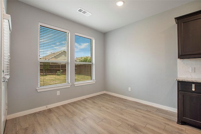 2151 Slow Stream Dr, Royse City, TX 75189 - unfurnished dining area with light wood-type flooring, baseboards, and recessed lighting
