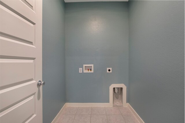 2151 Slow Stream Dr, Royse City, TX 75189 - laundry area featuring hookup for an electric dryer, hookup for a washing machine, light tile patterned flooring, and baseboards