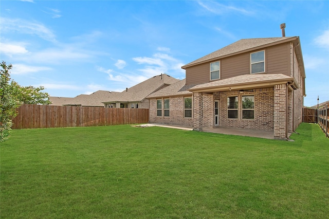 2151 Slow Stream Dr, Royse City, TX 75189 - rear view of property featuring a patio, brick siding, and roof with shingles