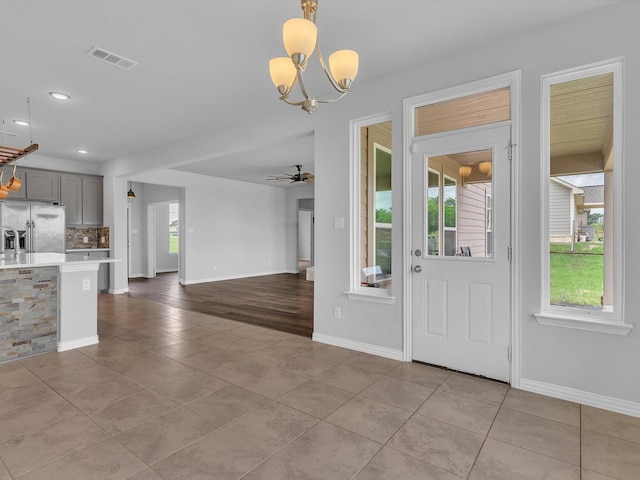 1013 Northern Oaks Ct, Springtown, TX 76082 - entrance foyer featuring tile patterned flooring, a chandelier, a ceiling fan, recessed lighting, and baseboards