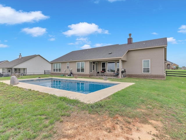 1013 Northern Oaks Ct, Springtown, TX 76082 - back of property with a patio area, a chimney, and brick siding
