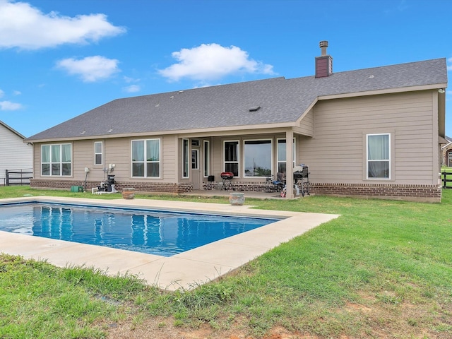 1013 Northern Oaks Ct, Springtown, TX 76082 - rear view of property with brick siding, a patio, an outdoor pool, and a chimney