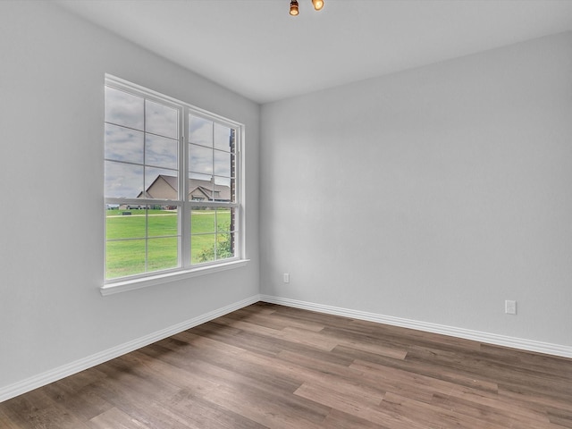 1013 Northern Oaks Ct, Springtown, TX 76082 - unfurnished room with wood finished floors and baseboards