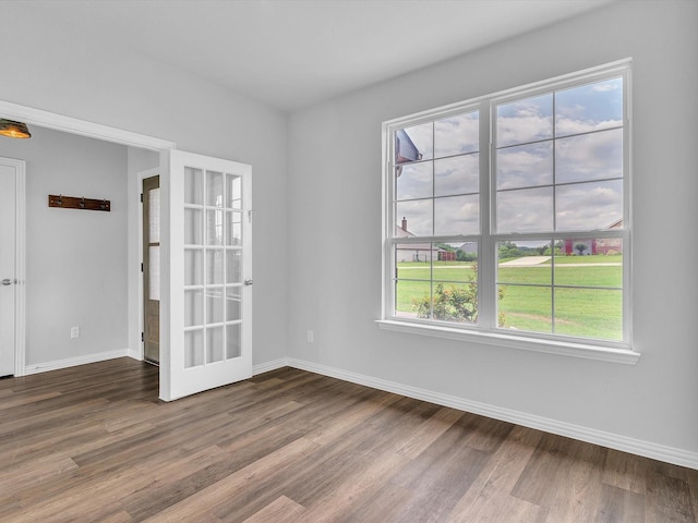 1013 Northern Oaks Ct, Springtown, TX 76082 - unfurnished room featuring dark wood finished floors, baseboards, and french doors