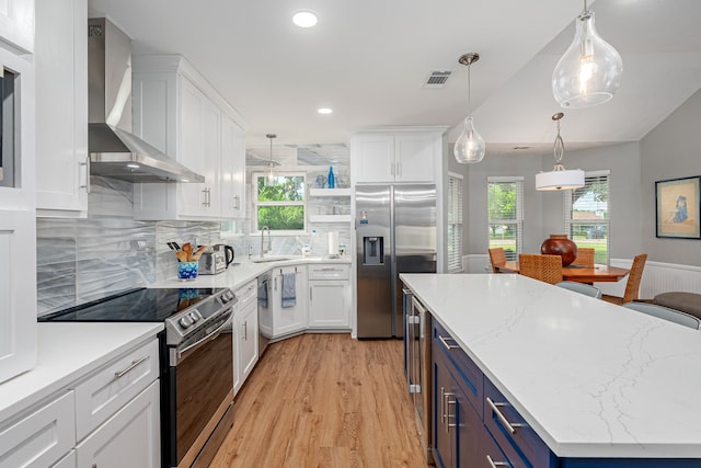 200 Settlers Bnd, Lowry Crossing, TX 75069 - kitchen with stainless steel appliances, a sink, wall chimney range hood, white cabinetry, and recessed lighting