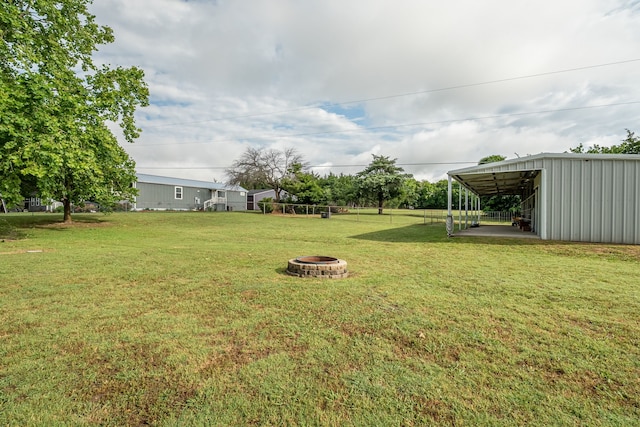 200 Settlers Bnd, Lowry Crossing, TX 75069 - view of green lawn with an outdoor fire pit and an outbuilding