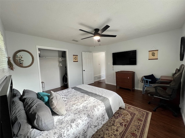 6049 Wormar Ave, Fort Worth, TX 76133 - bedroom with a closet, wood finished floors, a ceiling fan, and a textured ceiling