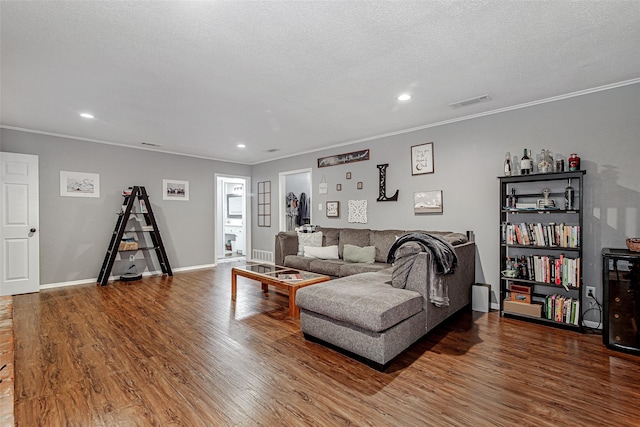 6049 Wormar Ave, Fort Worth, TX 76133 - living room featuring wood finished floors, recessed lighting, ornamental molding, and a textured ceiling