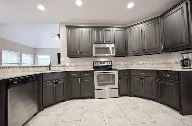 606 Brandt St, Grandview, TX 76050 - kitchen featuring stainless steel appliances, ceiling fan, a sink, backsplash, and light tile patterned flooring